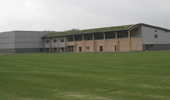 Project: Burnley FC Training Ground. Material: 21 x 140 Thermowood D Mineral Grey Coated. 42 x 42 Grey Batten.