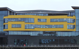 University of Wales, Usk Way, Newport. Profile: PSE Trims 17mm x 60mm, 32mm x 38mm & 32mm x 50mm. Colour: Laura Ashby Yellow CCS40574. Installed : 2009  Image taken 2017